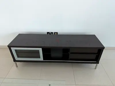 Dark brown TV unit / entertainment console with glass door