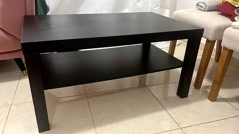 Simple black wooden coffee table with lower shelf - good condition