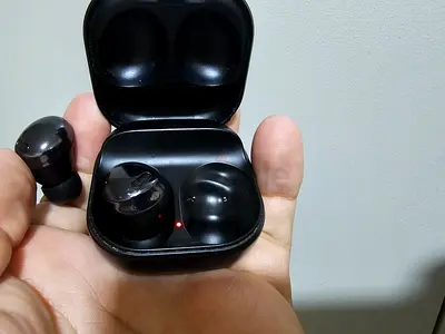 Used black true wireless earbuds with charging case - working condition