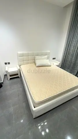 White King Bed Frame with Mattress and Two Nightstands