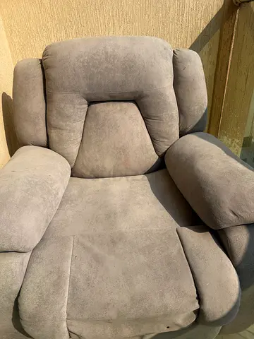 Light grey reclining armchair in good used condition