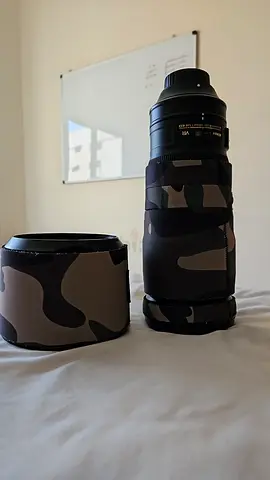 Telephoto zoom lens with with DSLR camouflage cover and lens hood - used, good condition