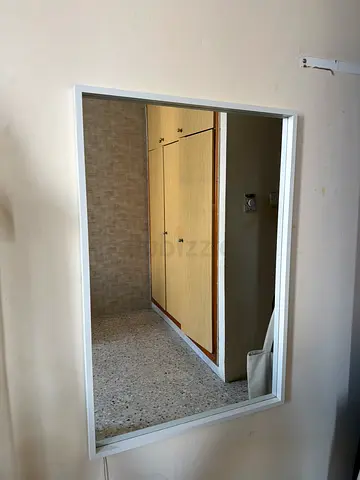 Wall-mounted rectangular mirror with white frame - good condition length 90 , width 65