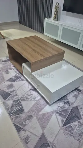 Modern two-tone sliding coffee table with storage - good condition