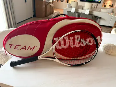 Wilson Team tennis racket with matching red Wilson cover