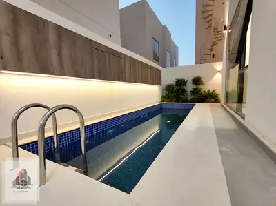 Elegant villa for sale, featuring a swimming pool, a rooftop terrace, and central AC