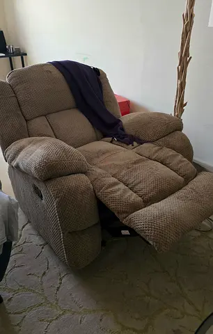 Comfortable single reclining armchair - light brown.