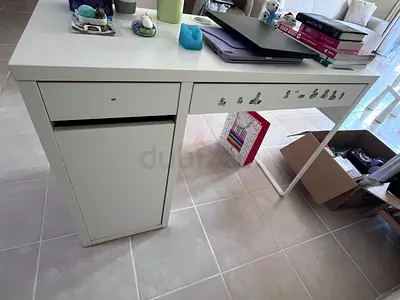 White tall storage cabinet with drawers and shelves