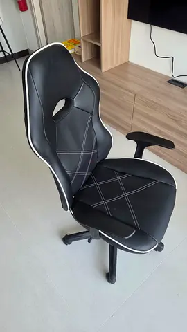 Black ergonomic office/gaming chair with adjustable height — good condition