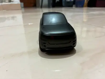Small matte black toy car - used