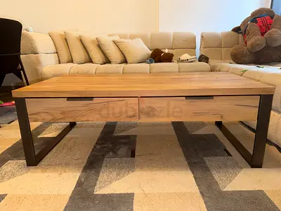 Wooden coffee table with drawers and black metal legs - good condition