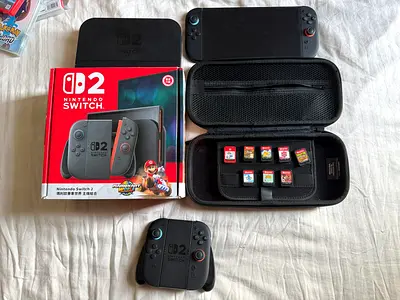 Nintendo switch 2 with extra joy cons and 8 extra games and carrying case