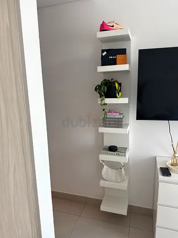 Slim white wall-mounted shelving unit - 6-tier display/storage