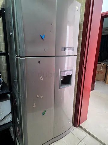Large double-door stainless steel refrigerator with water dispenser