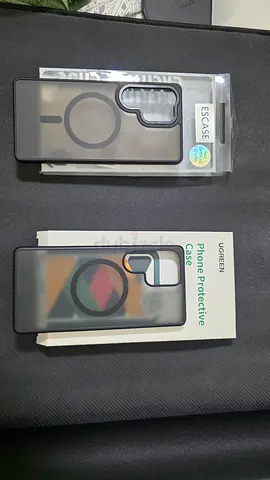 Two MagSafe-compatible protective phone cases (black/smoke) - unused