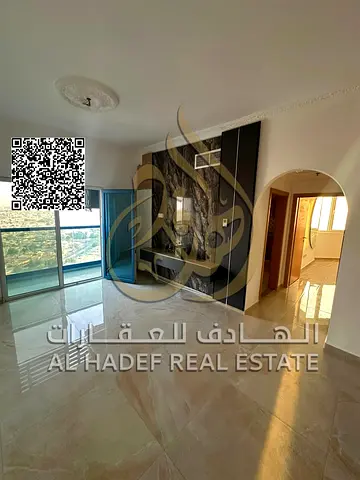 A bedroom and living room in Al Nuaimiyah 3, second floor, with two bathrooms and a balcony with an open view, near Al Murad Mall and Carrefour, 38,00
