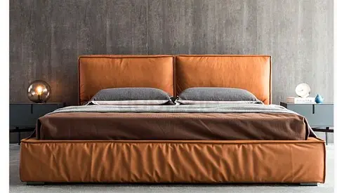 Modern brown leather king-size platform bed with padded headboard