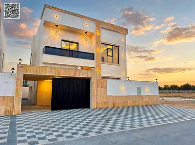 A 5-bedroom villa for sale in Al Helio area, Ajman. The villa features a fully equipped kitchen wit
