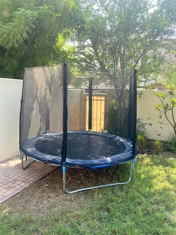 Used round trampoline with safety net - good condition