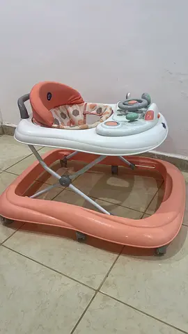 Gently used baby walker with activity tray - salmon/white