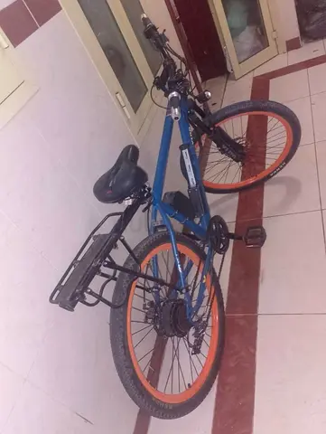 Used Electric blue mountain bike with rear rack, 26-inch wheels Without battery