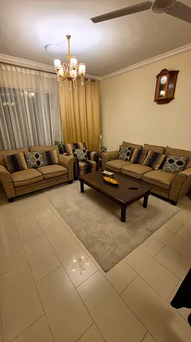 Beige 3-piece Sofa Set with Coffee Table and Cushions - Good Condition