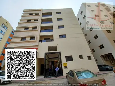 Two-bedroom apartment with a living room for rent in Al Hamidiya; includes a balcony. The building is for families.