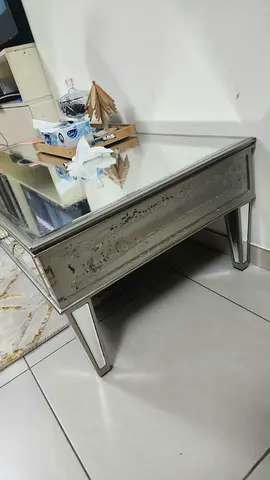 Mirrored glass coffee table with distressed silver finish