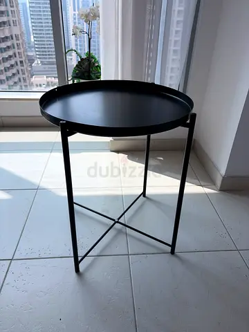 Small round black metal side table, modern minimalist design