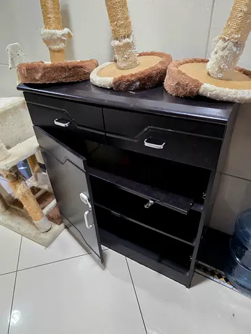 Used brown wooden TV stand / storage cabinet - door needs a fix