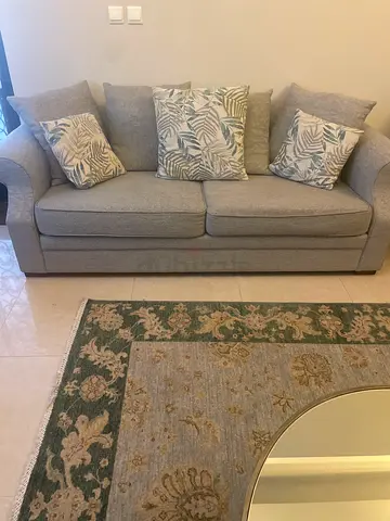 Light grey 3-seater sofa with decorative cushions