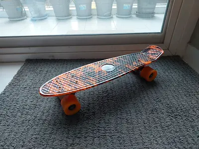 Orange plastic cruiser skateboard with soft wheels for kids- good condition