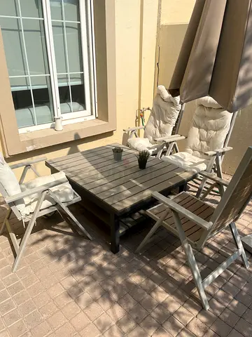 Outdoor garden dining set - table with 4 cushioned chairs