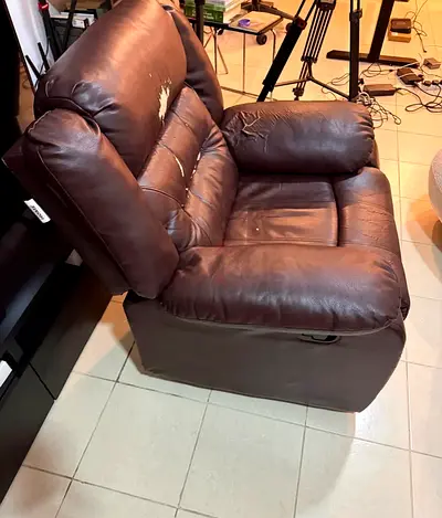Brown leather recliner armchair — single seat (used)