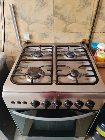 Used 4-Burner Gas Stove with Oven - Good Working Condition. Brand elekta