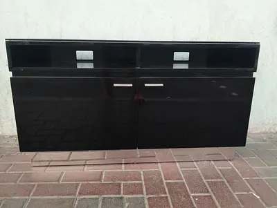 Black glossy wall-mounted TV cabinet with storage
