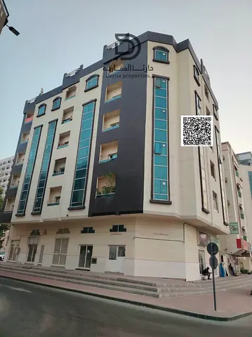 Corner Building on Two Streets for Sale in Al Rashidiya 1, Ajman | AED 825K Annual Income | 30 Rooms, 1 Studio & 5 Shops | 10.06% ROI