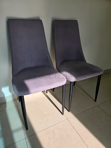 Set of 2 grey upholstered dining chairs with metal legs