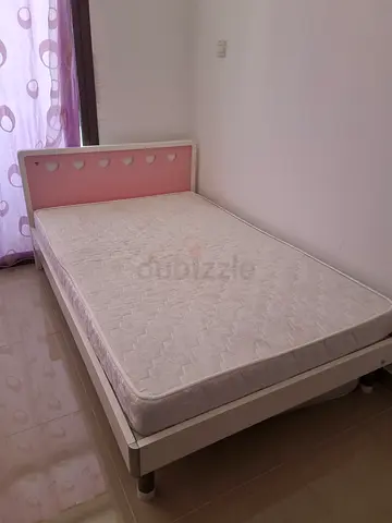 Two white and pink bed frame with two mattress