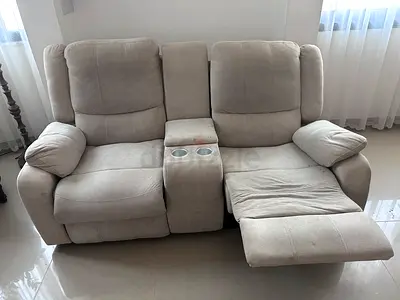 Beige 2 Seater Recliner Sofa with Center Console, one recliner side not working