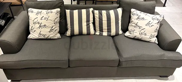 3-seater grey fabric sofa with cushions — well maintained and good condition