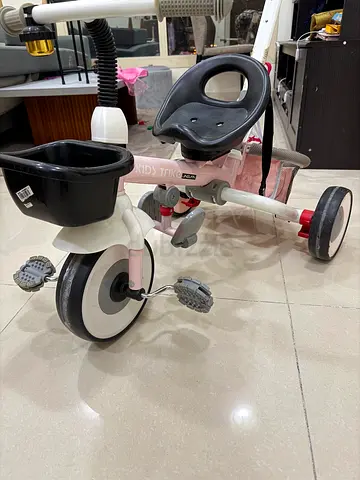 Lightweight pink toddler tricycle with push handle