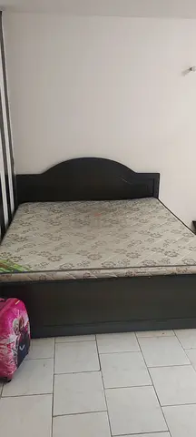 Dark wood double bed frame with mattress - good condition