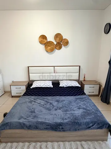 Queen bed frame with headboard and two bedside tables - light wood