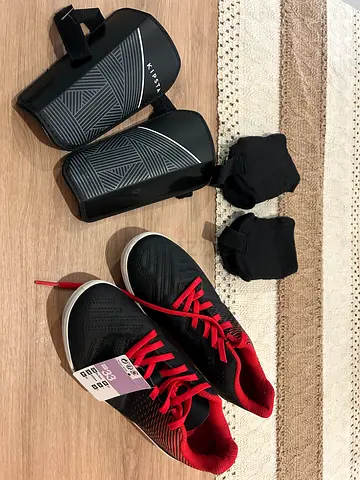 Football boots with shin pads