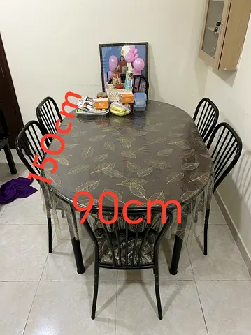Oval dining table with 6 chairs - 150cm x 90cm, black metal set