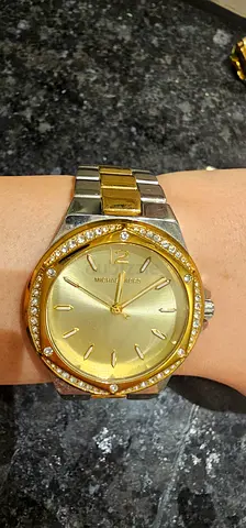 Gold-tone Michael Kors two-tone women's watch with crystal bezel