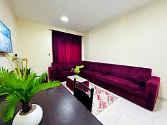 Two rooms and a living area, located opposite Thumbay Hospital, with easy access to Dubai; all utili
