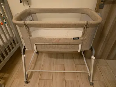 Giggles beige bedside bassinet in good condition