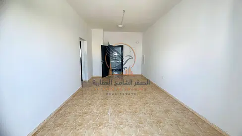 For annual rent One bedroom apartment with a living room in Al Rashidiya 2 Ajman Excellent space balcony open view prime location near Ladies Park